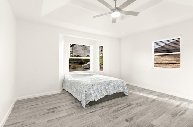 312 N Alamo St, Alton, TX 78573 - bedroom with ceiling fan, baseboards, and light wood finished floors