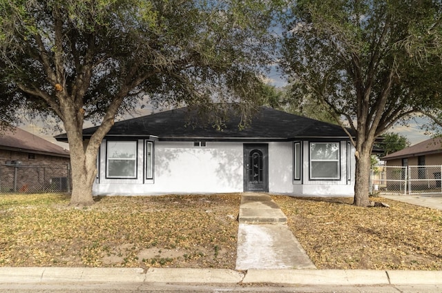 312 N Alamo St, Alton, TX 78573 - ranch-style house featuring stucco siding and fence