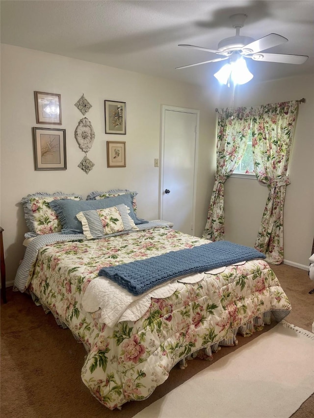 69 Greenbriar Dr, Conroe, TX 77304 - carpeted bedroom featuring a ceiling fan