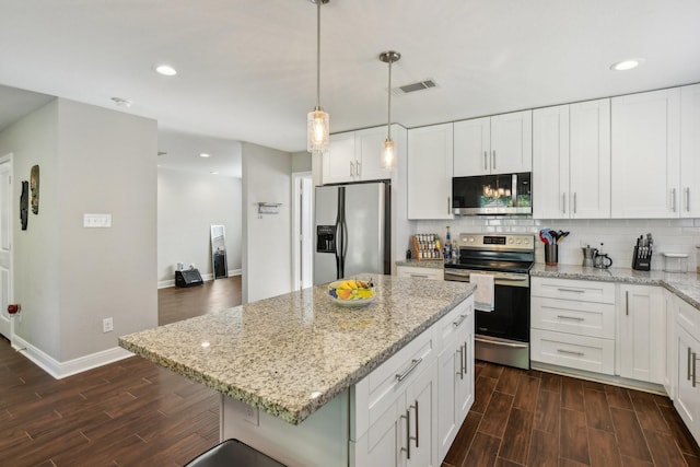 1006 Glacier Hill Dr, Houston, TX 77077 - kitchen featuring appliances with stainless steel finishes, dark wood-style flooring, decorative backsplash, baseboards, and recessed lighting