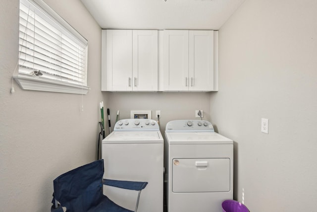 1006 Glacier Hill Dr, Houston, TX 77077 - laundry area with washer and dryer and cabinet space