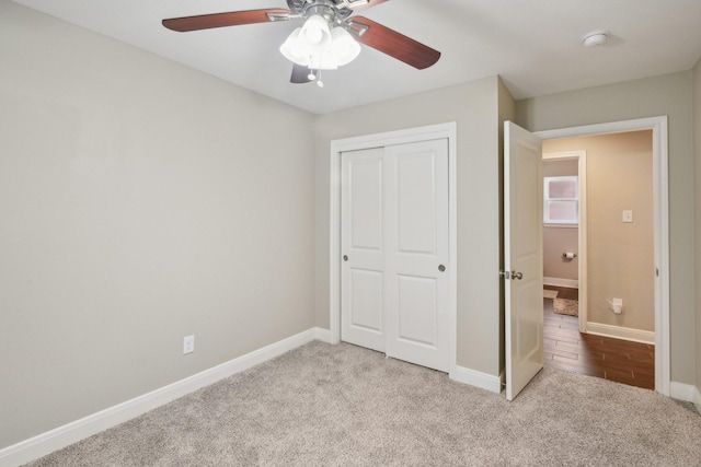 1006 Glacier Hill Dr, Houston, TX 77077 - unfurnished bedroom featuring carpet floors, a closet, baseboards, and a ceiling fan