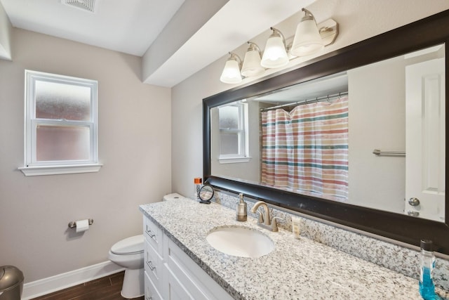 1006 Glacier Hill Dr, Houston, TX 77077 - bathroom with toilet, baseboards, vanity, and healthy amount of natural light