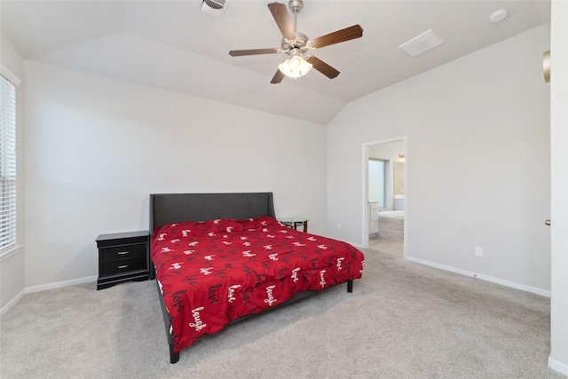 carpeted bedroom with baseboards, vaulted ceiling, and visible vents