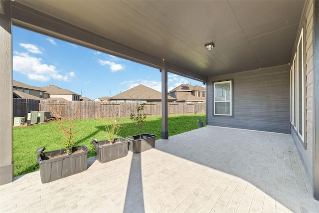 view of patio / terrace with a residential view and a fenced backyard