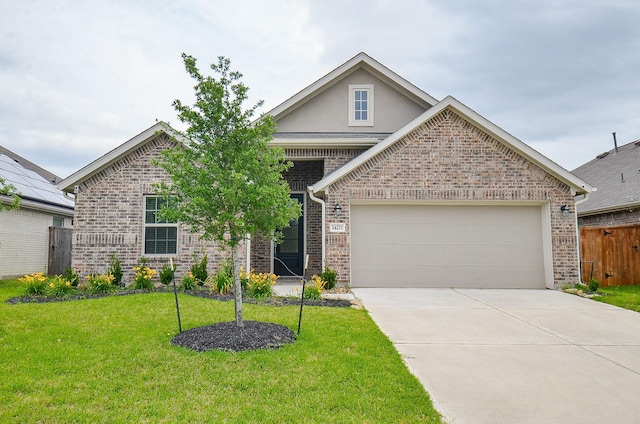14211 Walworth Creek Ct, Rosharon, TX 77583 - craftsman house featuring a garage, brick siding, driveway, and a front yard