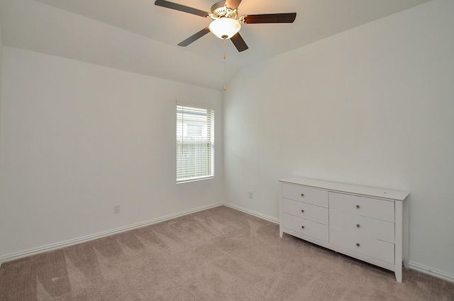 14211 Walworth Creek Ct, Rosharon, TX 77583 - spare room with baseboards, light carpet, ceiling fan, and vaulted ceiling