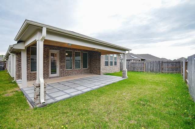 14211 Walworth Creek Ct, Rosharon, TX 77583 - rear view of property with a patio area, brick siding, and a fenced backyard