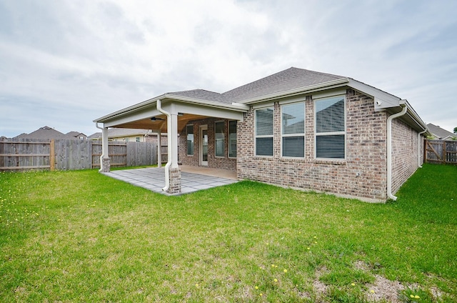 14211 Walworth Creek Ct, Rosharon, TX 77583 - back of house featuring a lawn, brick siding, ceiling fan, a patio area, and a fenced backyard
