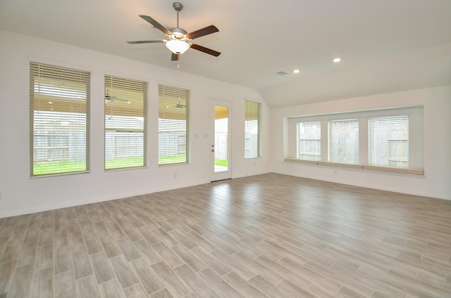 14211 Walworth Creek Ct, Rosharon, TX 77583 - unfurnished living room featuring a ceiling fan, lofted ceiling, and light wood-type flooring