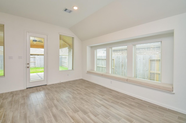 14211 Walworth Creek Ct, Rosharon, TX 77583 - empty room featuring lofted ceiling, recessed lighting, baseboards, visible vents, and light wood-style floors
