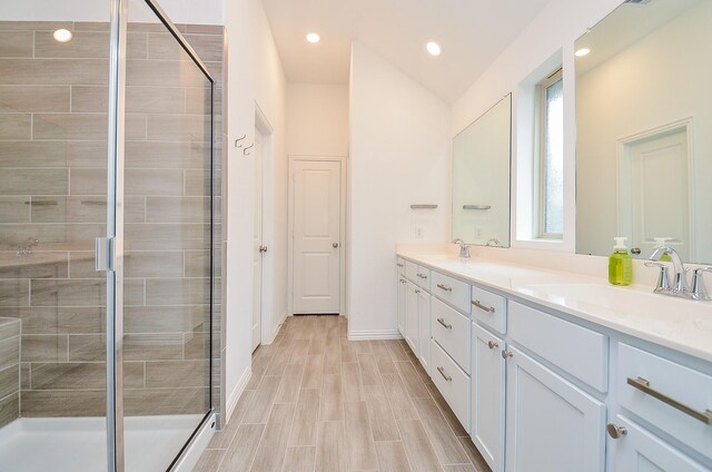 14211 Walworth Creek Ct, Rosharon, TX 77583 - full bath featuring a shower stall, recessed lighting, double vanity, and a sink