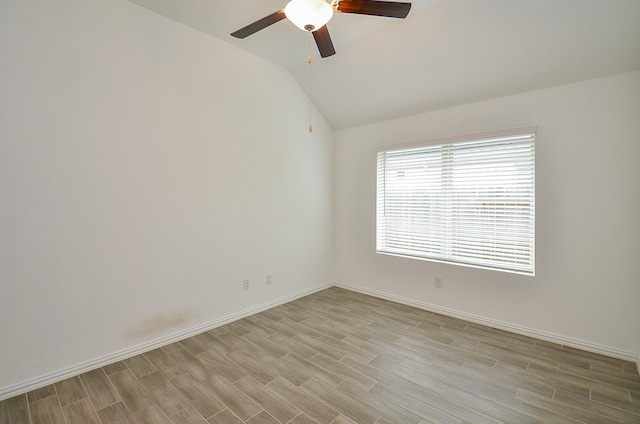 14211 Walworth Creek Ct, Rosharon, TX 77583 - empty room with lofted ceiling, baseboards, a ceiling fan, and light wood-style floors