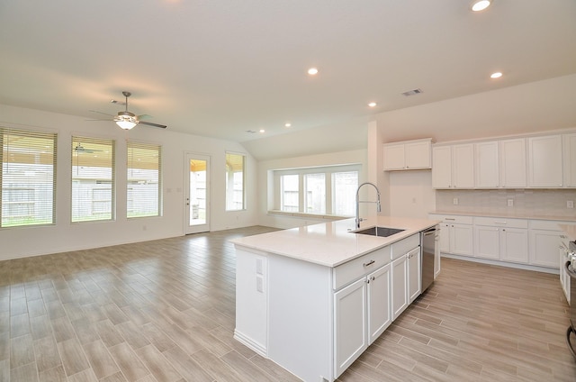 14211 Walworth Creek Ct, Rosharon, TX 77583 - kitchen with a sink, visible vents, recessed lighting, light wood finished floors, and stainless steel dishwasher