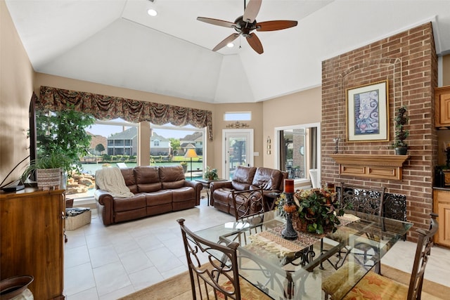 living area with a brick fireplace, ceiling fan, recessed lighting, high vaulted ceiling, and light tile patterned flooring