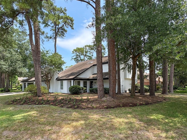 12430 Oakcroft Dr, Houston, TX 77070 - view of front of house with a front yard and stucco siding