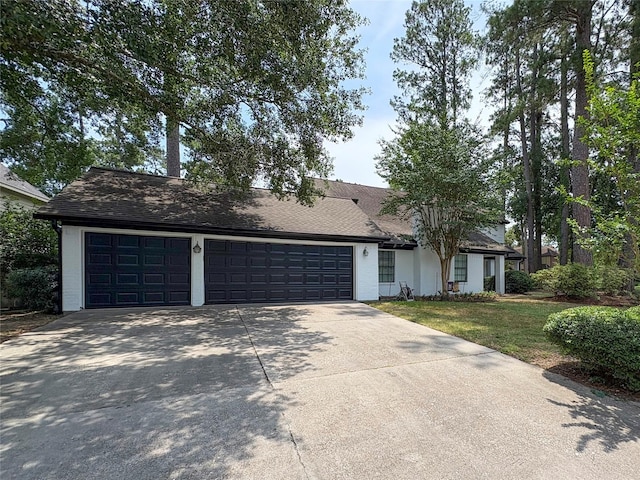 12430 Oakcroft Dr, Houston, TX 77070 - mid-century home with driveway, an attached garage, and a front yard