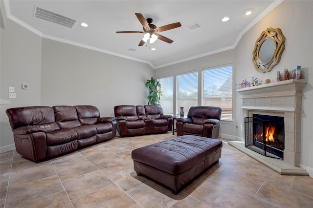 living room with visible vents, a ceiling fan, baseboards, and a lit fireplace