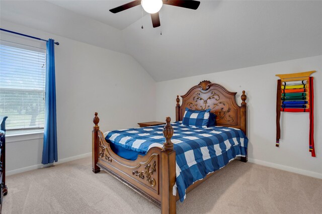 carpeted bedroom with baseboards, ceiling fan, and lofted ceiling