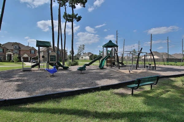 6003 Tarra Firma Dr, Spring, TX 77379 - community jungle gym featuring a residential view