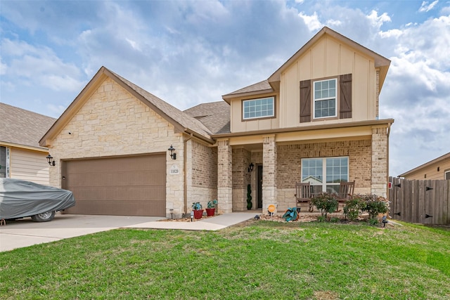 traditional-style home with a front yard, brick siding, board and batten siding, and an attached garage