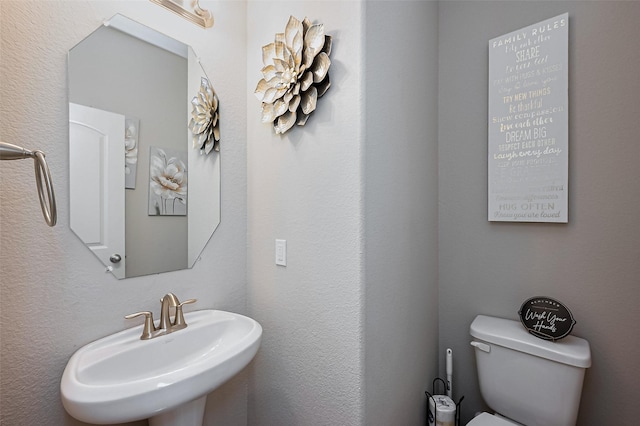 bathroom with a sink and toilet