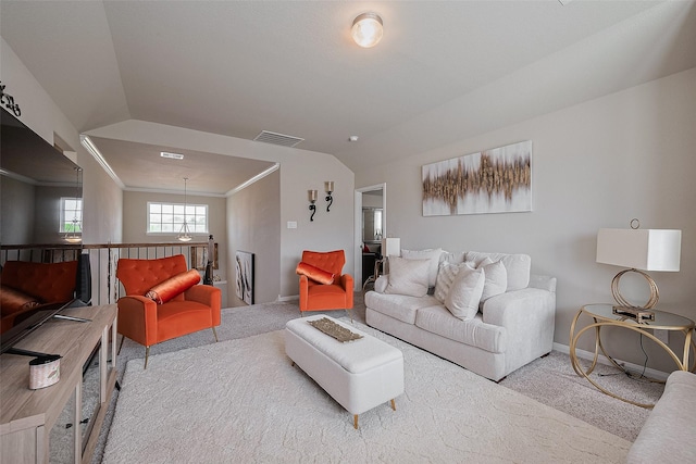 carpeted living room featuring crown molding, vaulted ceiling, visible vents, baseboards, and a notable chandelier