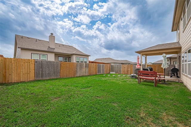 view of yard with a fenced backyard