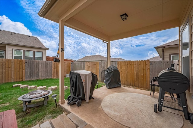 view of patio / terrace featuring a fenced backyard and an outdoor fire pit