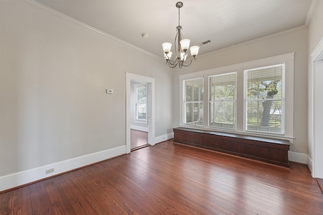 unfurnished room with a chandelier, baseboards, visible vents, and wood-type flooring