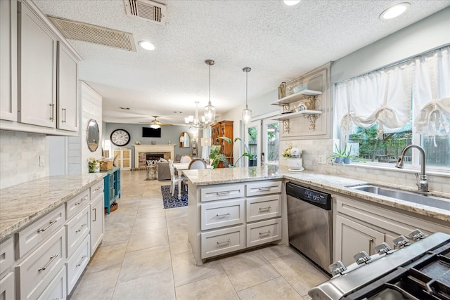 21263 Park Bluff Dr, Katy, TX 77450 - kitchen featuring a sink, a peninsula, a textured ceiling, and dishwasher