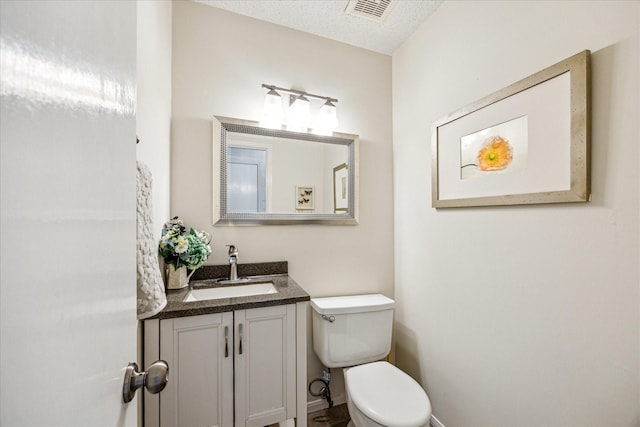 21263 Park Bluff Dr, Katy, TX 77450 - bathroom featuring vanity, visible vents, and toilet