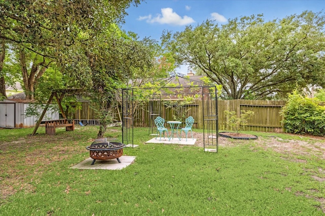21263 Park Bluff Dr, Katy, TX 77450 - view of yard with a patio, a fenced backyard, a gazebo, an outdoor fire pit, and a storage shed