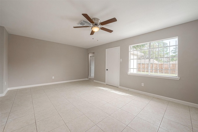 8714 Valley Flag Dr, Houston, TX 77078 - unfurnished room with visible vents, baseboards, a ceiling fan, and light tile patterned flooring
