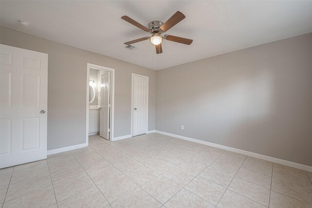 8714 Valley Flag Dr, Houston, TX 77078 - unfurnished bedroom featuring ceiling fan, light tile patterned floors, baseboards, and visible vents