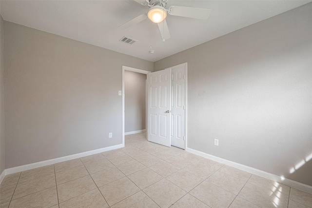 8714 Valley Flag Dr, Houston, TX 77078 - spare room featuring light tile patterned floors, visible vents, baseboards, and a ceiling fan