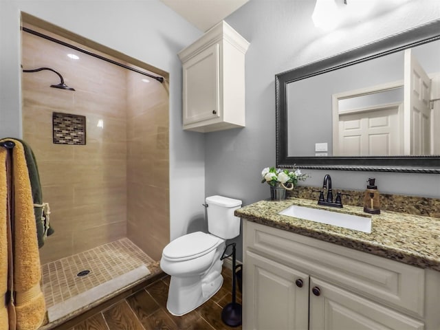 19507 Balsas Dr, Porter, TX 77365 - full bathroom with toilet, vanity, a shower stall, and wood tiled floor