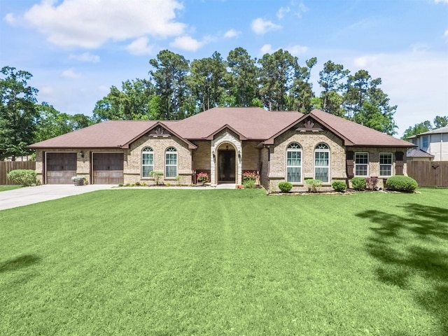 19507 Balsas Dr, Porter, TX 77365 - view of front of property with fence, a front lawn, brick siding, an attached garage, and driveway