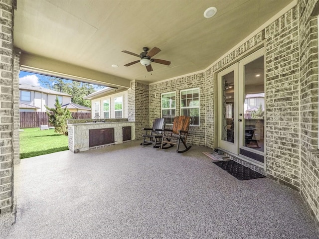 19507 Balsas Dr, Porter, TX 77365 - view of patio / terrace with a sink, fence, and a ceiling fan