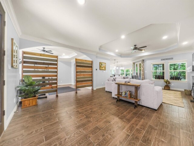 19507 Balsas Dr, Porter, TX 77365 - living area featuring a raised ceiling, ceiling fan, ornamental molding, and wood tiled floor