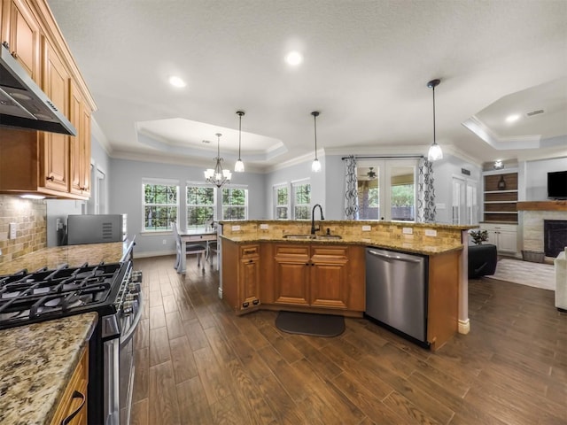 19507 Balsas Dr, Porter, TX 77365 - kitchen featuring open floor plan, a sink, appliances with stainless steel finishes, and a raised ceiling