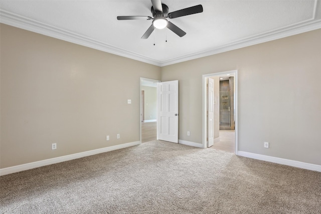 unfurnished bedroom with light carpet, crown molding, baseboards, and ensuite bath