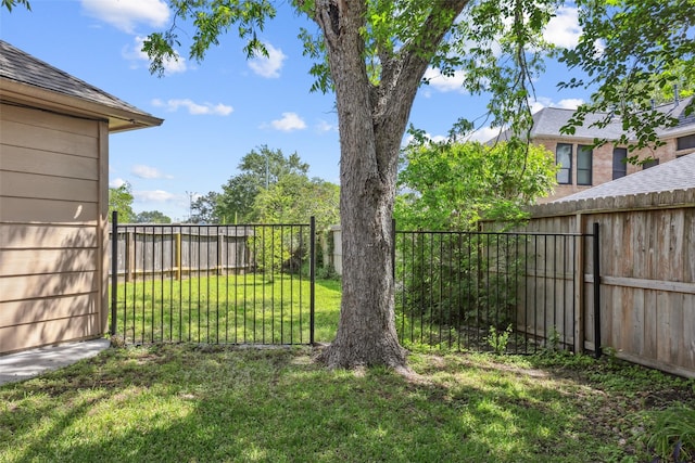 view of yard with a fenced backyard