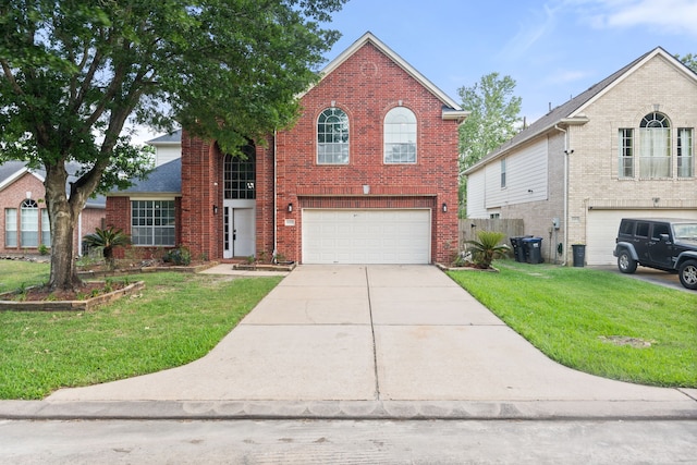 traditional-style house with a front lawn, brick siding, driveway, and a garage
