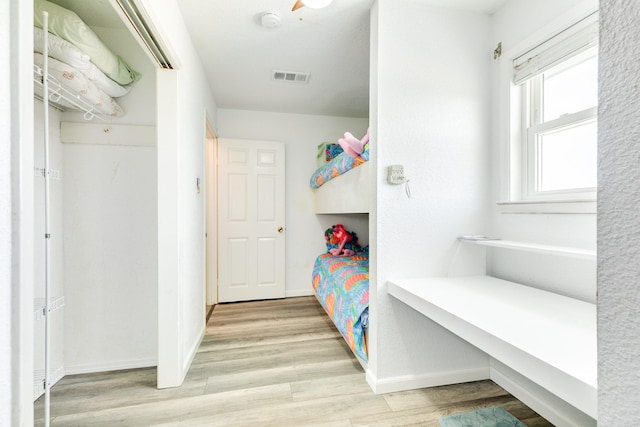bedroom with baseboards and light wood-style floors