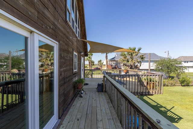 16634 Francis Drake Rd, Jamaica Beach, TX 77554 - deck with a lawn and a residential view