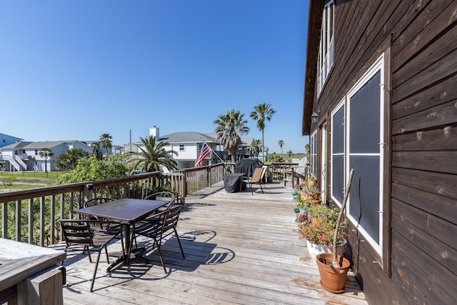 16634 Francis Drake Rd, Jamaica Beach, TX 77554 - wooden deck featuring a residential view and outdoor dining space