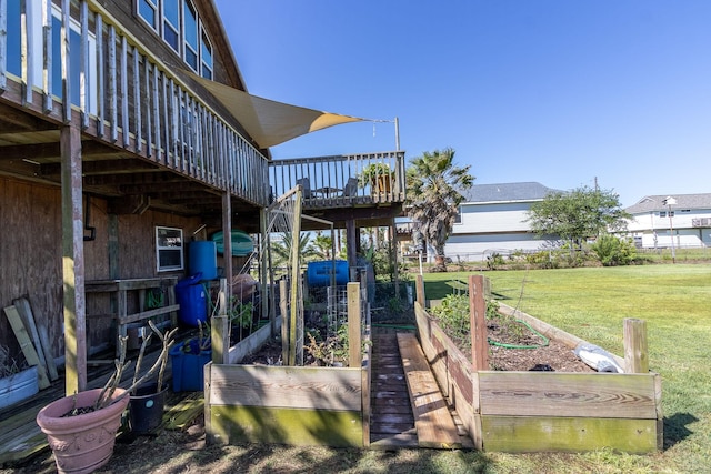 16634 Francis Drake Rd, Jamaica Beach, TX 77554 - exterior space with a wooden deck, a garden, and a yard