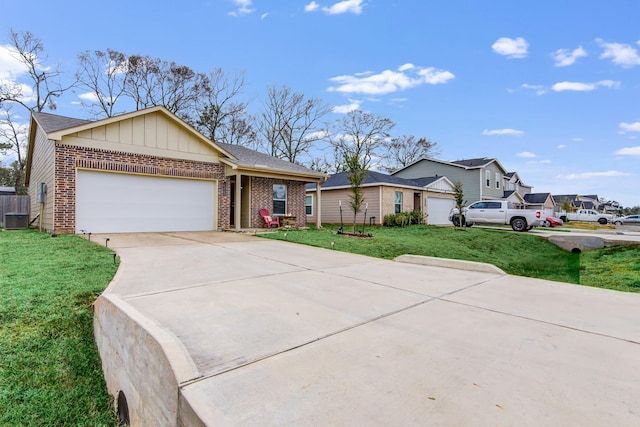 15560 Briar Forest Dr, Conroe, TX 77306 - single story home with brick siding, driveway, a garage, a front lawn, and central AC