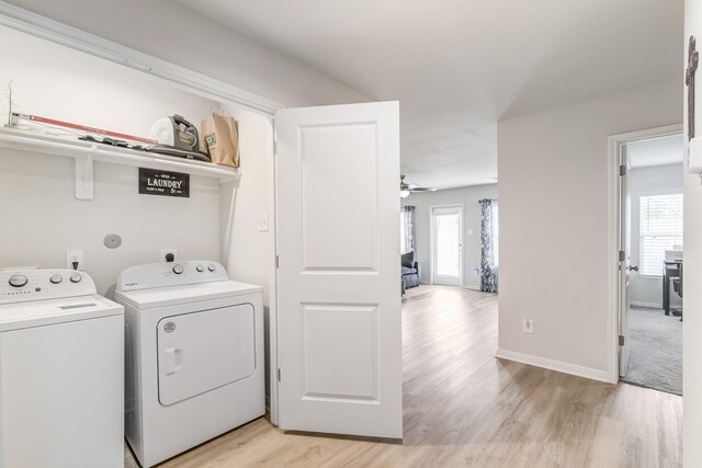 15560 Briar Forest Dr, Conroe, TX 77306 - laundry area featuring separate washer and dryer, light wood-type flooring, a ceiling fan, and baseboards